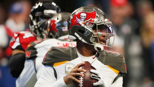 Tampa Bay Buccaneers quarterback Jameis Winston (3) during  looks to throw against the Falcons at Mercedes-Benz Stadium in Atlanta.