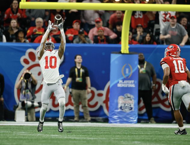 Ohio State Buckeyes wide receiver Xavier Johnson is wide open as he make this reception for a touchdown during the second quarter of the College Football Playoff Semifinal between the Georgia Bulldogs and the Ohio State Buckeyes at the Chick-fil-A Peach Bowl In Atlanta on Saturday, Dec. 31, 2022. (Jason Getz / Jason.Getz@ajc.com)
