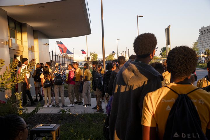 Participants of Delta’s Dream Flight 2022 event line up to pass through security at Hartsfield-Jackson Atlanta International Airport on Friday, July 15, 2022. Around 150 students ranging from 13 to 18 years old will fly from Atlanta to the Duluth Air National Guard Base in Duluth, Minnesota. (Chris Day/Christopher.Day@ajc.com)