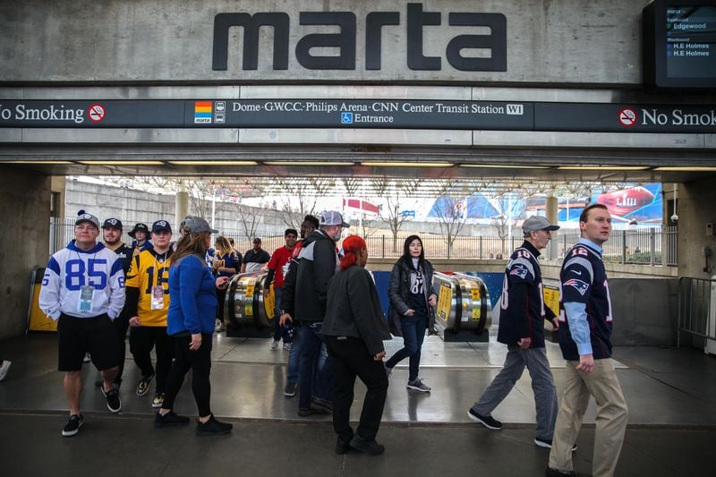 Passengers arrive at the Georgia World Congress Center MARTA stop before the Super Bowl 53 football game between the Los Angeles Rams and New England Patriots, Sunday, Feb. 3, 2019, in Atlanta. (BRANDEN CAMP/SPECIAL)