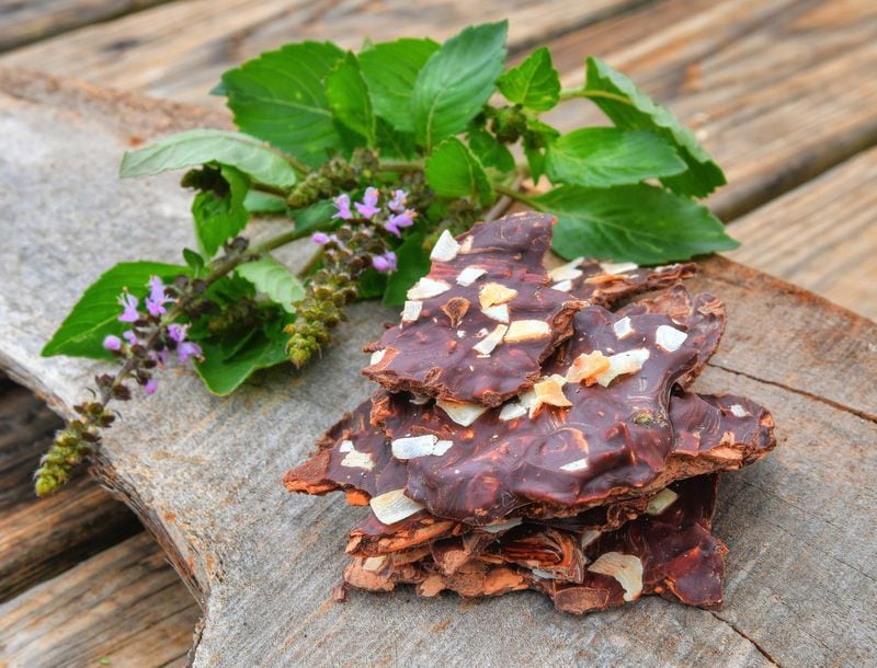 Holy Basil-Coconut-Dark Chocolate Bark includes an herb that UGArden’s Noelle Joy says is “considered an adaptogen, meaning it belongs to a class of herbs that can help your body adapt to stress.” STYLING BY NOELLE JOY / CONTRIBUTED BY CHRIS HUNT PHOTOGRAPHY