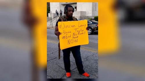 Trevan Young protesting in Chattanooga, Tennessee. Later, he was arrested for having a disassembled AR-15 in his backpack. Photo from Young’s lawyer, McCracken Poston.