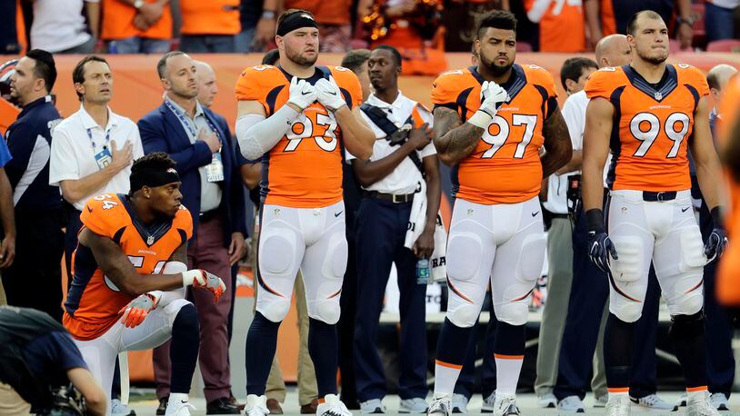 Denver Broncos inside linebacker Brandon Marshall (54) kneels during the National Anthem prior to an NFL football game against the Carolina Panthers, Thursday, Sept. 8, 2016, in Denver. (AP Photo/Joe Mahoney)