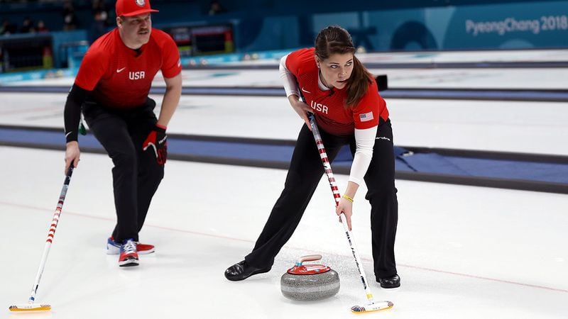 PYEONGCHANG-GUN, SOUTH KOREA - FEBRUARY 08:  Becca Hamilton and Matt Hamilton of the United States deliver a stone in the Curling Mixed Doubles Round Robin Session 1 during the PyeongChang 2018 Winter Olympic Games at Gangneung Curling Centre on February 8, 2018 in Pyeongchang-gun, South Korea.  (Photo by Ronald Martinez/Getty Images)