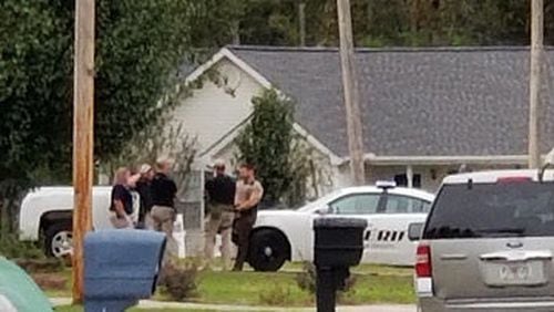 GBI agents search the Rossville residence of a Fort Oglethorpe police officer.