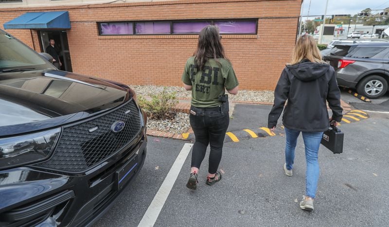 An FBI agent enters the Clarkston Police Department on Thursday morning as the search for 1-year-old Blaise Barnett continued for a second day.