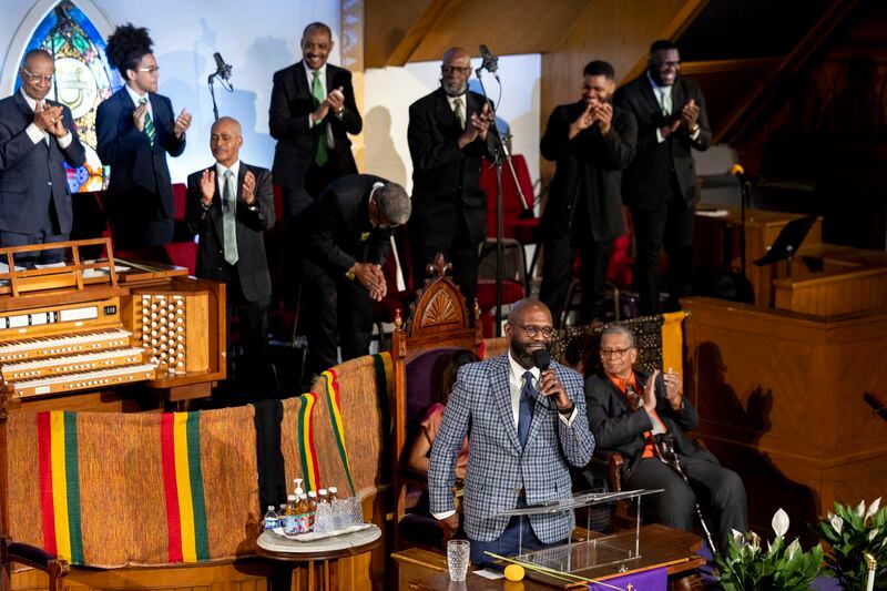 Rev. William H. Lamar IV, front, leads a Palm Sunday service at the Metropolitan AME Church in Washington, Sunday, March 24, 2024. Lamar says their churches are still feeling the pandemic’s impact on attendance, even as they have rolled out robust online worship options to reach people. (AP Photo/Amanda Andrade-Rhoades)