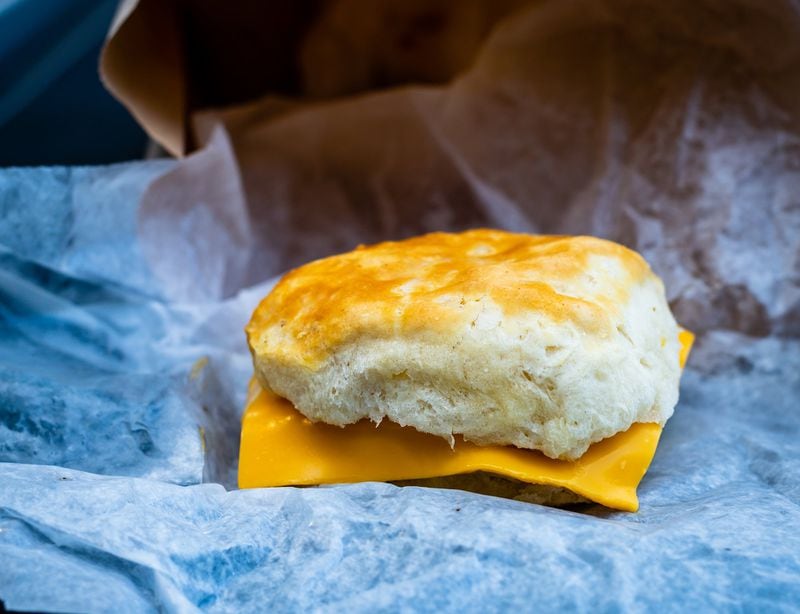 The cheese biscuit at Stilesboro Biscuits in Kennesaw is a cloudlike treat sandwiched around a slice of American cheese. CONTRIBUTED BY HENRI HOLLIS