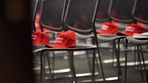 "Make America great again" hats await attendees at a Republican event at the Capitol. As President-elect Donald Trump plans his transition to power, he appears to be increasingly uncomfortable with outsiders and suspicious of the "bicoastal elite," in the words of an insider.