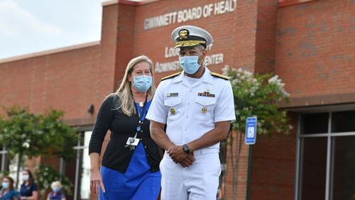 U.S. Surgeon General Jerome Adams (right) and Gwinnett Newton Rockdale Health Director Audrey Arona walk to the podium for a press conference amid a rise in coronavirus cases in Gwinnett County outside the Louise Radloff Administrative Building in Lawrenceville on Thursday, July 2, 2020. (Hyosub Shin / Hyosub.Shin@ajc.com) AJC FILE PHOTO