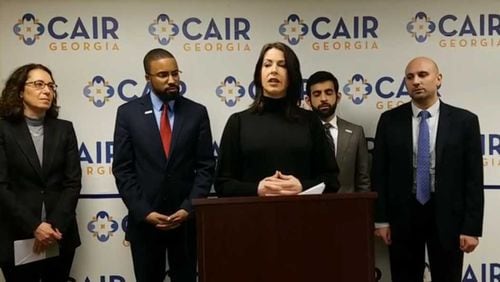 Abby Martin (center) speaks at a news conference on Monday, about a lawsuit she filed on Feb. 10, 2020 against Georgia Southern University.