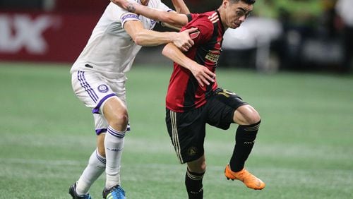 Atlanta United Miguel Almiron gets past an Orlando City defender on his way to his second goal of the match during the second half in a MLS soccer match on Saturday, June 30, 2018, in Atlanta.