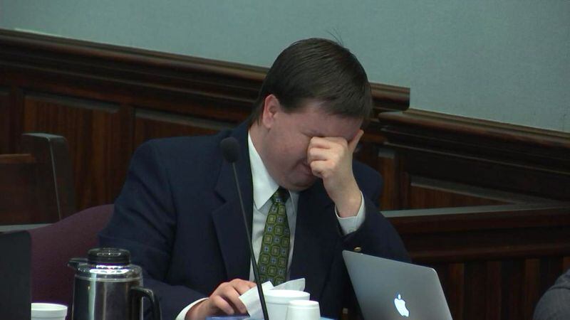 Justin Ross Harris breaks down while listening to a description of what his son's Cooper would have felt in the final hours before his death. Brian Frist, who in 2014 was the Cobb County Chief Medical Examiner, had been testifying during the murder trial of Justin Ross Harris at the Glynn County Courthouse in Brunswick, Ga., on Tuesday, Oct. 18, 2016. (screen capture via WSB-TV)