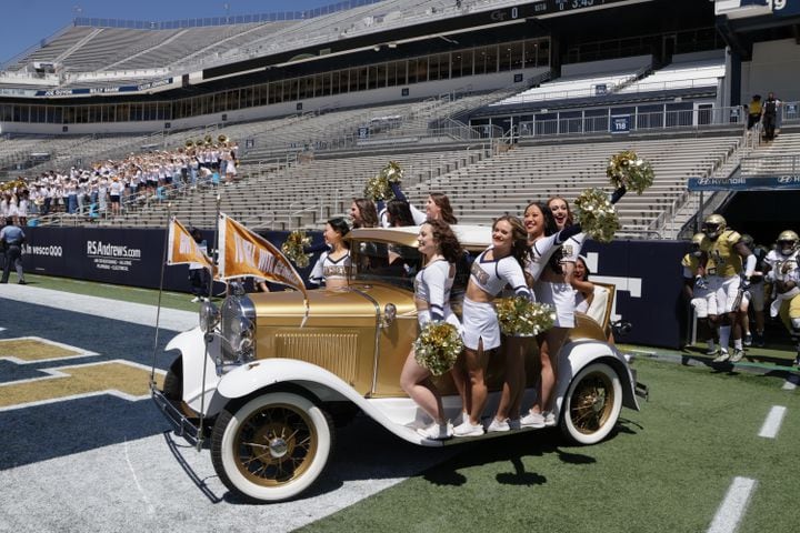 Cheerleaders ride the  Ramblin' Wreck onto the field during the Spring White and Gold game at Bobby Dodd Stadium at Hyundai Field In Atlanta on Saturday, April 13, 2024.   (Bob Andres for the Atlanta Journal Constitution)