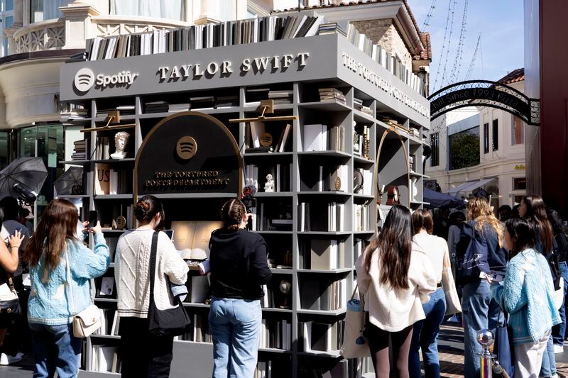 Taylor Swift fans check out a new pop-up opening to celebrate Taylor Swift's upcoming album "The Tortured Poets Department," at the Grove in Los Angeles on Wednesday, April 17, 2024. (AP Photo/Richard Vogel)