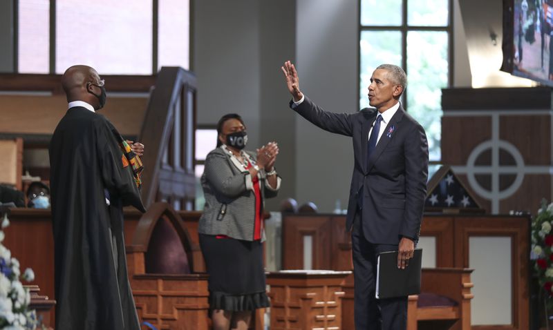 7/30/20 - Atlanta, GA -  Former President Barack Obama waves to the crowd after he delivered the eulogy.  On the sixth day of the “Celebration of Life” for Rep. John Lewis, his funeral is  held at Ebenezer Baptist Church in Atlanta, with burial to follow.   Alyssa Pointer / alyssa.pointer@ajc.com
