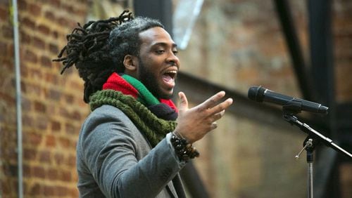 Adan Bean performs at a poetry slam at the Roswell Historic Cottage during the 2017 Roswell Roots festival  JASON GETZ / AJC FILE