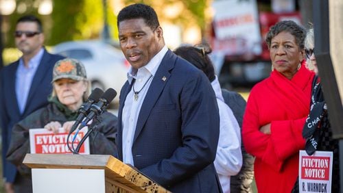 Republican Herschel Walker speaks Tuesday near the Columbia Tower at MLK Village apartments in Atlanta, where he tried to blame Ebenezer Baptist Church and his opponent, Democratic U.S. Sen. Raphael Warnock,, the church's senior pastor, of trying to evict disadvantaged residents. The building is owned by a for-profit entity with ties to Warnock and Ebenezer. A spokesman for the building said no evictions have taken place at there for failure to pay rent since June 2020. Steve Schaefer/steve.schaefer@ajc.com)