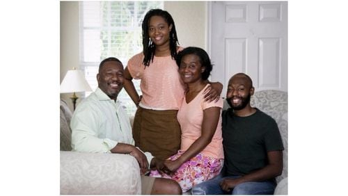 Palm Beach Post reporter Wayne Washington with his wife Shelia, and their kids Ashley and Wayne II, at their home in Wellington on September 2, 2017. Washington recently went through Ancestry.com to find out more about his family background. (Richard Graulich / The Palm Beach Post)