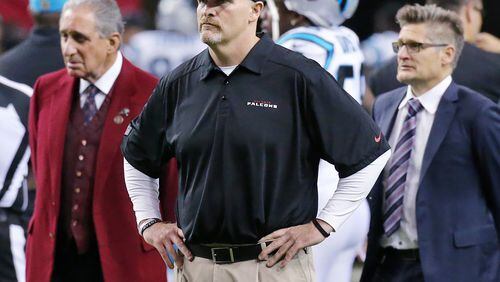 122815 ATLANTA: Falcons owner Arthur Blank (from left), head coach Dan Quinn, and general manager Thomas Dimitroff watch the team warmup before playing the Panthers in a football game on Sunday, Dec. 27, 2015, in Atlanta. The Falcons are looking to play better than in their rematch after a recent 38-0 loss to the Panthers in Charlotte. Curtis Compton / ccompton@ajc.com