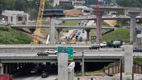 August 9 2019 Sandy Springs/Atlanta - Picture shows construction site of I-285 interchange at Ga. 400 in Sandy Springs on Friday, August 8, 2019. I-285 is showed in foreground (horizontal) and Ga. 400 northbound is shown in middle (south to north). Construction is peaking on one of the biggest road projects in Georgia history, and motorists are enduring the hassles that come with it. The new $800 million I-285 interchange at Ga. 400 in Sandy Springs will be bigger than Spaghetti Junction, and the scale of the work is becoming visible as new rise ramps above the existing interchange. When itâs completed, it will ease traffic at one of the busiest stretches of highway in the Southeast and serve as a linchpin for metro Atlantaâs growing network of toll lanes. In the meantime, commuters must navigate a constant maze of lane and road closures, detours and congestion. (Hyosub Shin / Hyosub.Shin@ajc.com)