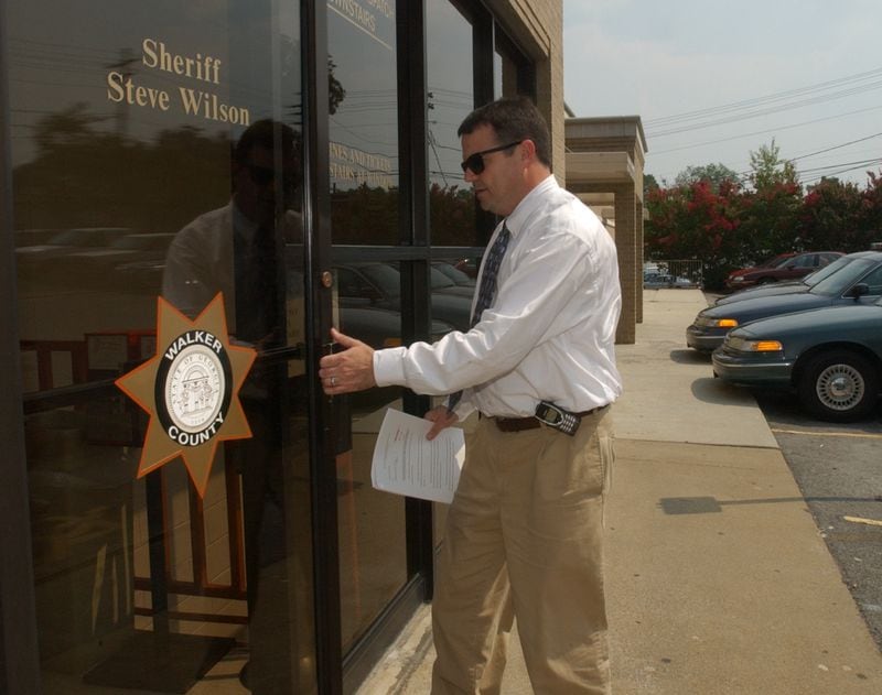 Attorney McCracken Poston pictured in 2002 entering the Walker County Sheriff’s Office. (T. LEVETTE BAGWELL/STAFF)