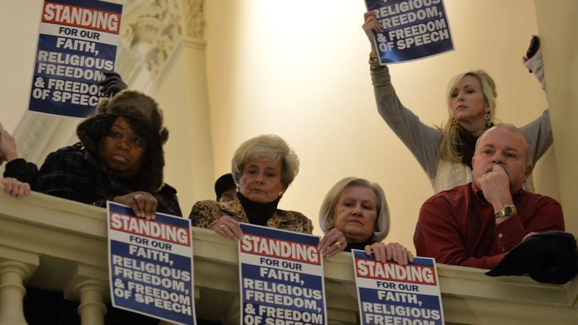 January 13, 2015 Atlanta: Supporters look down on the Standing for Religious Freedom Rally at the state Capitol Tuesday January 13, 2015. The rally was in support of fired Atlanta Fire Chief Kelvin Cochran. Cochran was terminated for controversy surrounding his self published book "Who Told You You Are Naked?", a 2013 book that some consider critical of gays. Mayor Kasim Reed contends Cochran was fired for not following rules, including not getting clearance to write the book. Hundreds gathered at the state Capitol before heading to city hall to deliver more than 40,000 petitions to the office of Mayor Kasim Reed. BRANT SANDERLIN / BSANDERLIN@AJC.COM