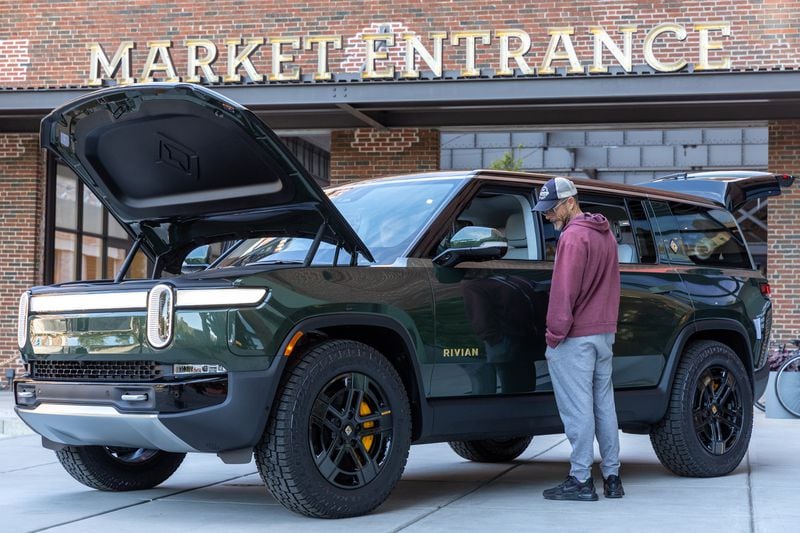 A display Rivian R1S SUV sits outside the company’s new showroom at Ponce City Market in Atlanta on Thursday, October 19, 2023. (Arvin Temkar / arvin.temkar@ajc.com)