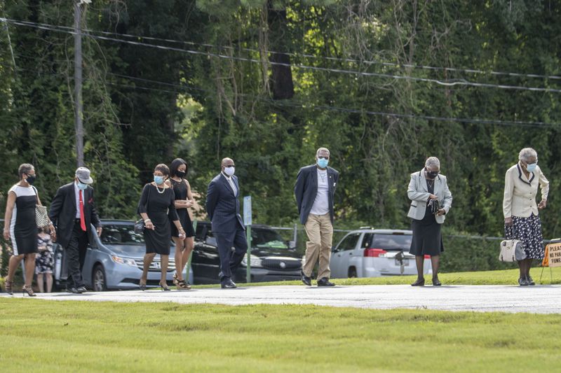 08/07/2020 - Marietta, Georgia - Family and friends of Herman Cain make their way into the chapel at Alfonso Dawson Mortuary to partake in his celebration of life ceremony in Atlanta's Harland terrace community, Friday, August 7, 2020. Cain, former Republican presidential candidate, businessman and radio broadcaster, died July 30 at the age of 74. The Henry County resident had been hospitalized for a month with COVID-19 after traveling throughout much of June, including to a rally for his ally President Donald Trump. (ALYSSA POINTER / ALYSSA.POINTER@AJC.COM)