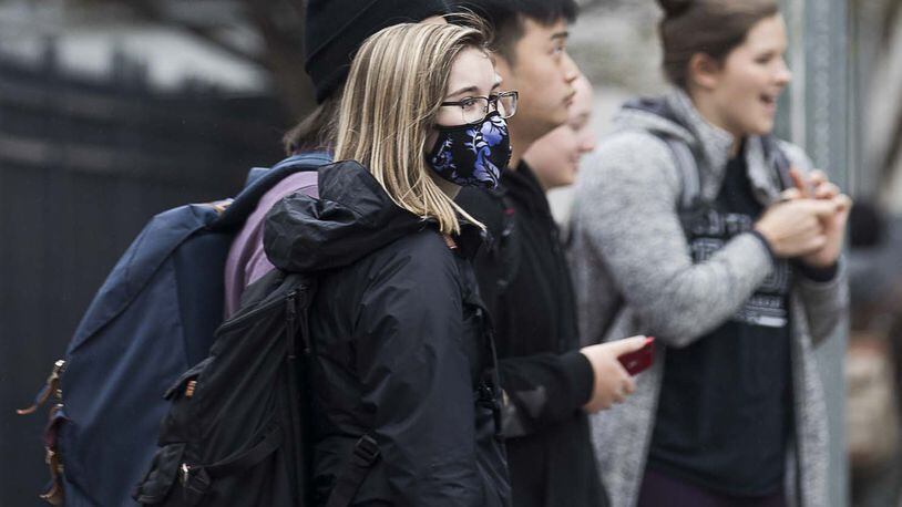 Georgia State University undergrad sophomore Emma Berman wears a face mask while navigating the university’s campus in Atlanta, Tuesday, March 10, 2020. University System of Georgia schools began requiring students to wear face coverings in classrooms and other campus facilities starting July 15. ALYSSA POINTER / ALYSSA.POINTER@AJC.COM