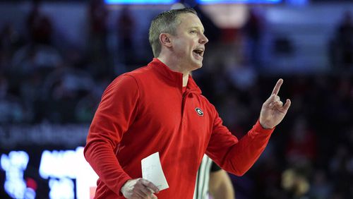 Georgia coach Mike White yells to his players on the court during the first half of an NCAA college basketball game against Auburn Wednesday, Jan. 4, 2023, in Athens, Ga. (AP Photo/John Bazemore)