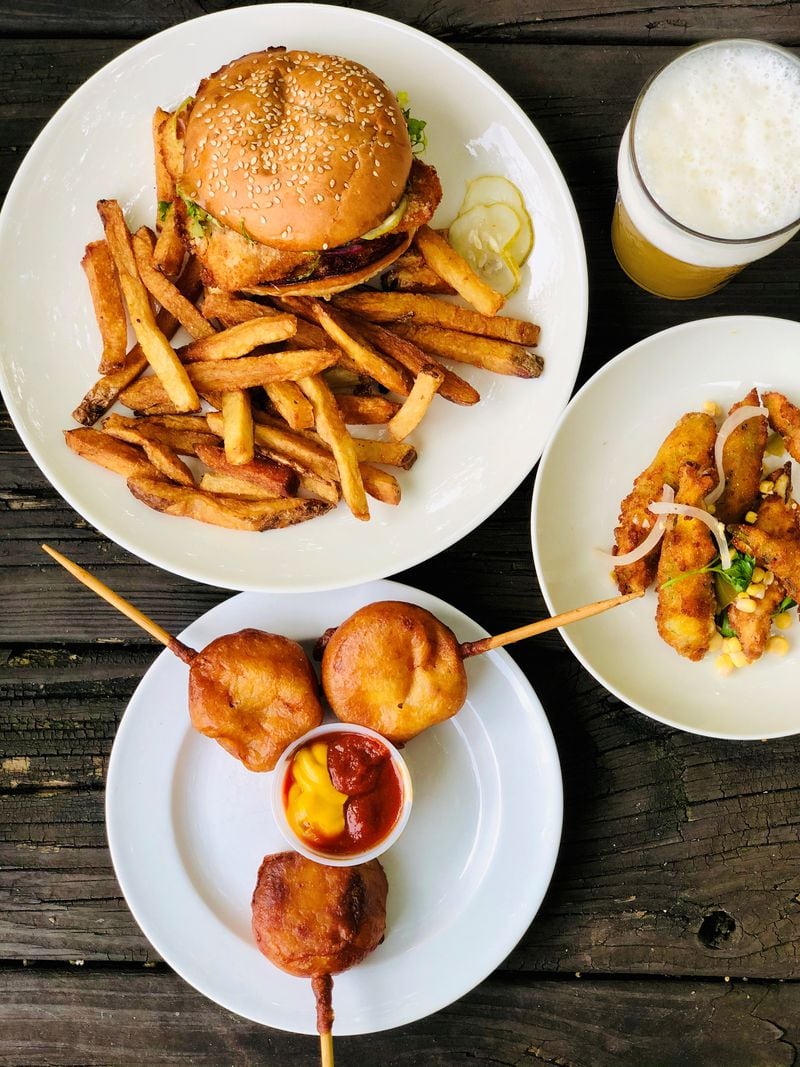 Takeout from Wrecking Bar: crispy cod sandwich with fries; corn pups, fried okra and the Juice Willis: What’s Just Hoppened IPA. 
Courtesy of Wendell Brock