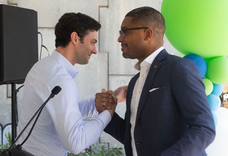 Sen. Jon Ossoff, left, and Assistant Secretary of Transportation for Transportation Policy Christopher Coes, right, embrace before Sen. Ossoff gives a speech highlighting the Atlanta’s Beltline receiving $25M construction grant on Mayson St. on Monday, July 24, 2023 in Atlanta. (Michael Blackshire/Michael.blackshire@ajc.com)