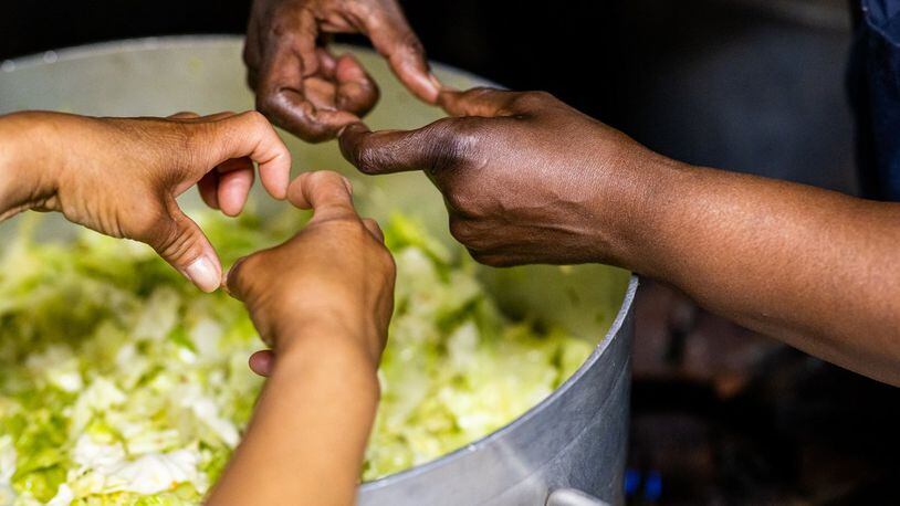 Volunteers work with food at the Grandma's Hands project in Oregon that seeks to teach healthy nutrition and reduce food insecurity. CIVIL EATS