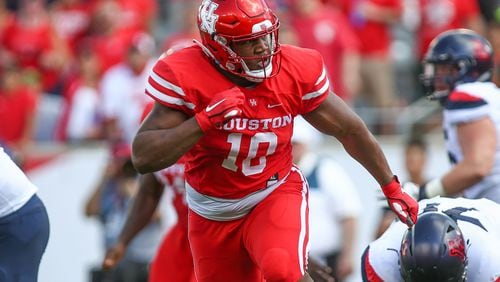 Houston defensive tackle Ed Oliver chases down a ball carrier during his team's game against Arizona.