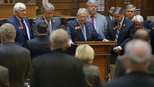 Georgia House Speaker David Ralston and House members take a moment before the start of business Tuesday to remember state Rep. John Meadows, R-Calhoun, who was the chairman of the House Rules Committee. Meadows died early Tuesday, the first day of the special session. BOB ANDRES / BANDRES@AJC.COM