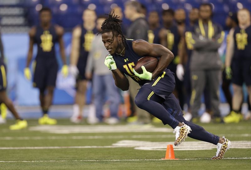 Tennessee running back Alvin Kamara runs a drill at the NFL football scouting combine Friday, March 3, 2017, in Indianapolis. (AP Photo/David J. Phillip)