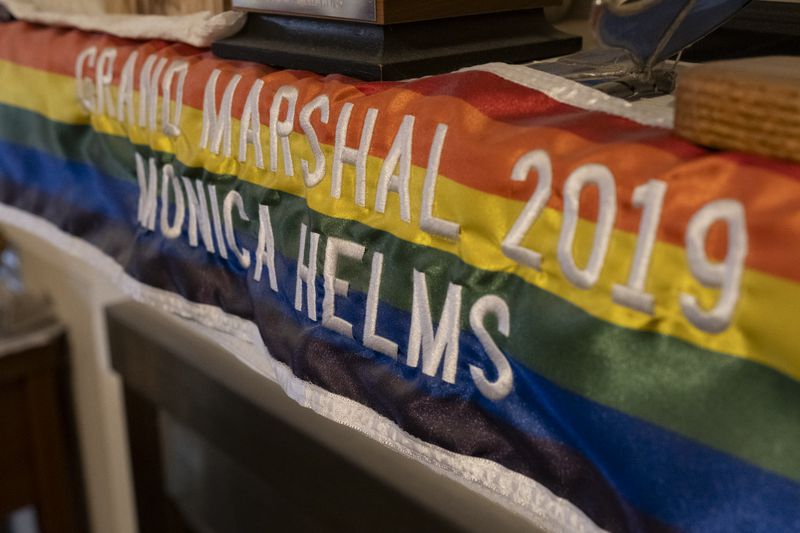 A pride banner on the mantle at Monica Helms’ home in Cobb County on Sunday, Dec. 10, 2023.   (Ben Gray / Ben@BenGray.com)
