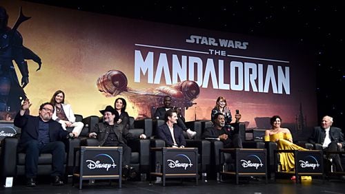 HOLLYWOOD, CALIFORNIA - NOVEMBER 13: (L-R) Executive Producer Jon Favreau, Composer Ludwig GÃ¶ransson, Executive Producer/Director Dave Filoni, Director Deborah Chow, Pedro Pascal, Rick Famuyiwa, Carl Weathers, Director Bryce Dallas Howard, Gina Carano and Werner Herzog speak onstage at the premiere of Lucasfilm's first-ever, live-action series, "The Mandalorian," at the El Capitan Theatre in Hollywood, Calif. on November 13, 2019. "The Mandalorian" streams exclusively on Disney+.  (Photo by Alberto E. Rodriguez/Getty Images for Disney)