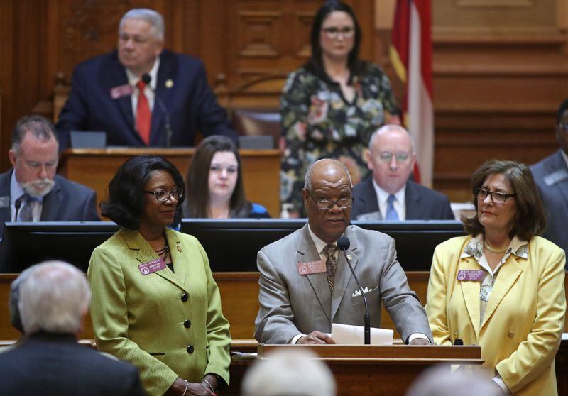 The longest serving member of the Georgia General Assembly, Rep. Calvin Smyre, D-Columbus, center, speaks about the passing of former Georgia Governor Zell Miller in the House Chamber during legislative day 38 at the Georgia State Capitol Friday, March 23, 2018, in Atlanta. Also shown is Rep. Carolyn Hugley, D-Columbus, left, and Rep. Debbie Buckner, D-Junction City. PHOTO / JASON GETZ