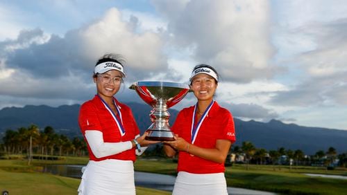 Thienna Huynh (left) and Sara Im pose with the trophy after winning the 2022 U.S. Women's Amateur Four-Ball on Sunday at Grand Reserve Golf Club in Rio Grande, Puerto Rico. (Chris Keane/USGA)