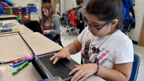 Fayette County is providing individual computers to all students in grades 2-12. AJC file photo