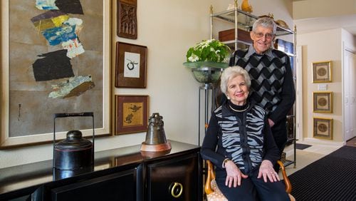Jim Halverson, a retired interior designer, and his wife, Darlene, live in the Mirabella Seattle retirement community with their amazing 60-year collection of art and memories. The small wood piece, at top, is a fragment from a church in Belgium, dated 1380. The painting at far left is by Paul Horiuchi. “It had been a horizontal collage,” Darlene says. “It works better vertically, so what the heck.” She’s sitting in one of two hand-carved 1959 Venice chairs, which they bought for $25 apiece. “We wouldn’t ever part with these. We’ve recovered them a couple of times,” she says. (Mike Siegel/The Seattle Times/TNS)
