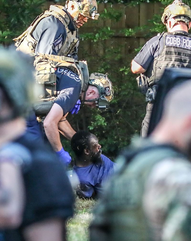 The man at the center of the SWAT standoff was expected to be charged with burglary, according to Cobb County police. He was not identified.