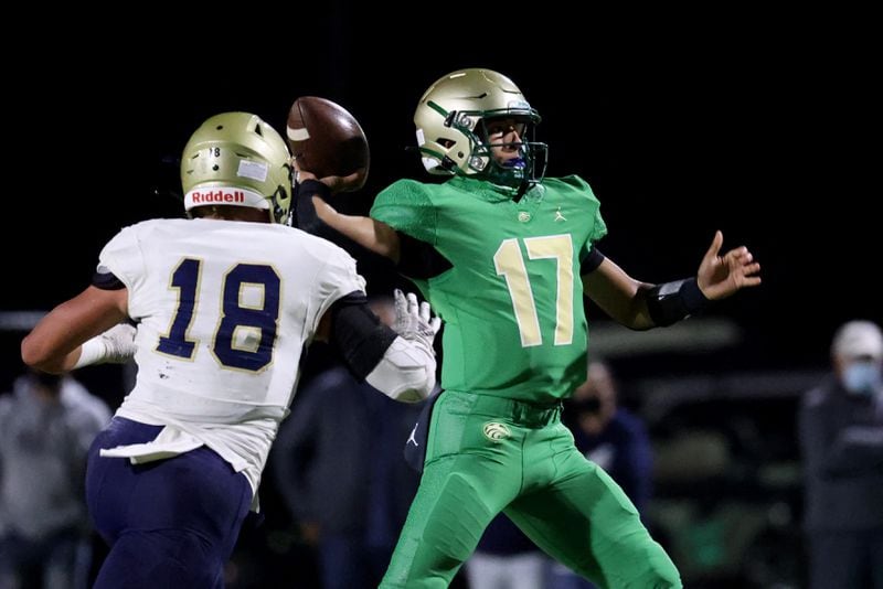 Buford quarterback Dylan Wittke (17) attempts a pass against Dacula linebacker Kyle Efford (18) in the first half at Buford high school Friday, November 20, 2020 in Buford, Ga.