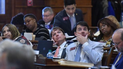 April 2, 2019 Atlanta - Rep. Spencer Frye (center) and other  members of the House vote on SB 200, relating to exercise of power to contract by the Georgia Department of Transportation, in the House Chambers during the last day of legislation  at the Georgia State Capitol on Tuesday, April 2, 2019.  HYOSUB SHIN / HSHIN@AJC.COM