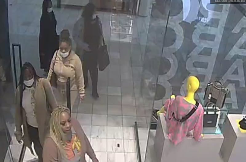 A group of four or five women is suspected of stealing around $2,500 worth of Marc Jacobs handbags from the designer's Lenox Square store.