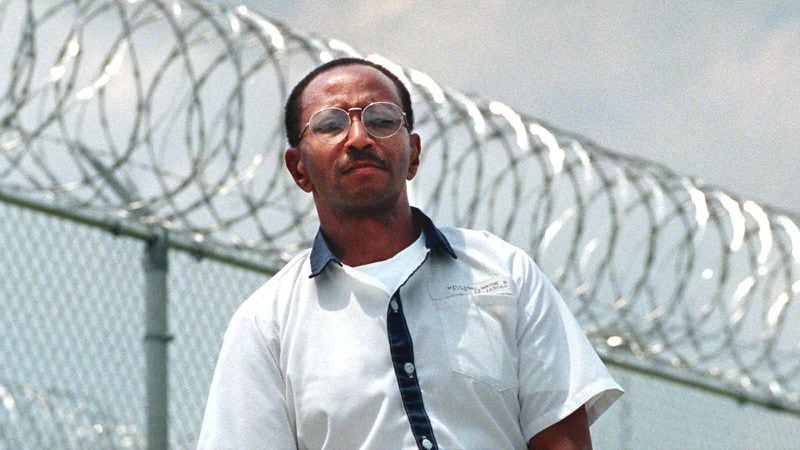 Convicted killer Wayne Williams is pictured in May 1999 near the fence line at Valdosta State Prison in Valdosta, Ga.