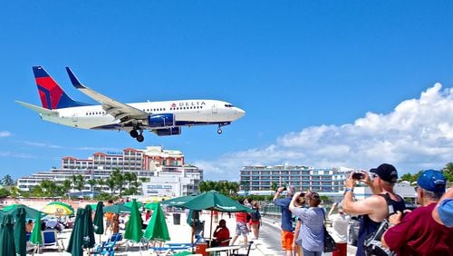 Photo of Delta plane landing at St. Maarten airport, pre-Hurricane Irma. Source: St. Maarten airport website.