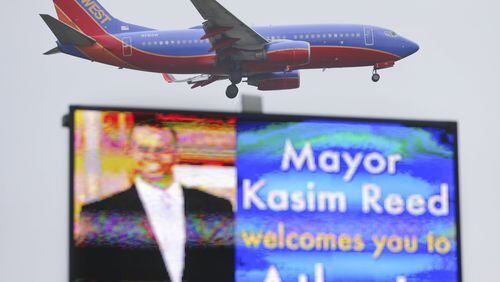 A billboard of Atlanta Mayor Kasim Reed welcomes people to the city. JOHN SPINK / JSPINK@AJC.COM AJC File Photo